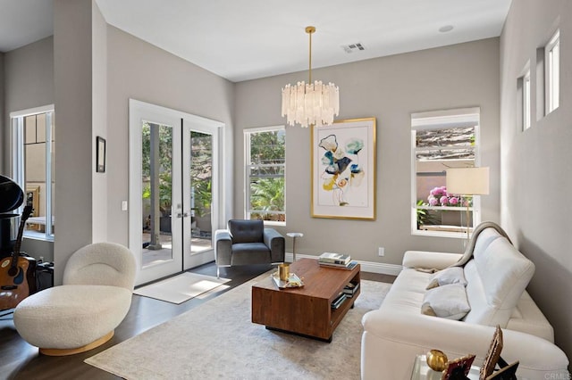 834 S Cedros, Solana Beach, CA 92075 - living room featuring wood finished floors, a chandelier, and french doors
