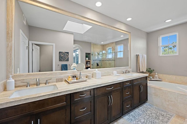 834 S Cedros, Solana Beach, CA 92075 - full bath with a skylight, double vanity, a stall shower, a garden tub, and recessed lighting