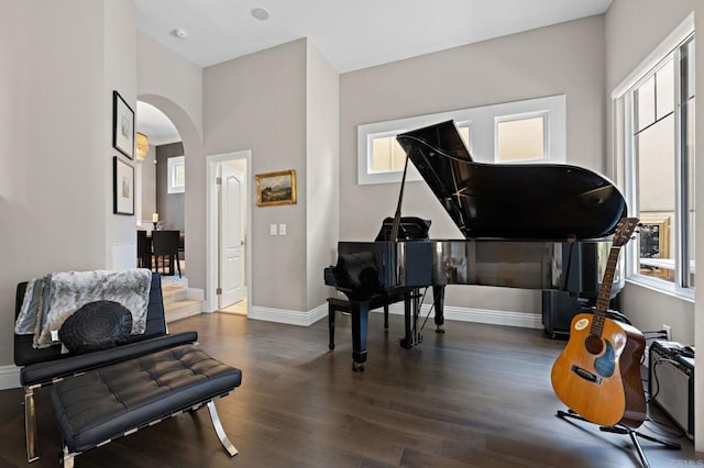 834 S Cedros, Solana Beach, CA 92075 - sitting room featuring arched walkways, healthy amount of natural light, and wood finished floors