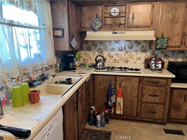 1113 Mohawk Unit 112, Topanga, CA 90290 - kitchen featuring under cabinet range hood, light countertops, white appliances, and tasteful backsplash