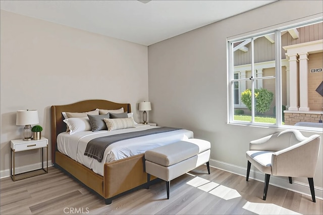 15530 Bonsai Way, Tustin, CA 92782 - bedroom featuring light wood finished floors and baseboards
