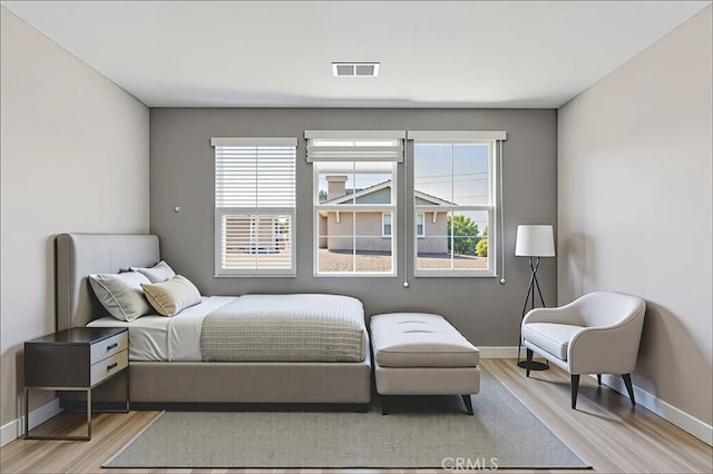 15530 Bonsai Way, Tustin, CA 92782 - bedroom featuring light wood finished floors and multiple windows