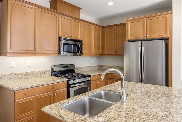 15530 Bonsai Way, Tustin, CA 92782 - kitchen with stainless steel appliances, recessed lighting, light stone counters, and brown cabinetry