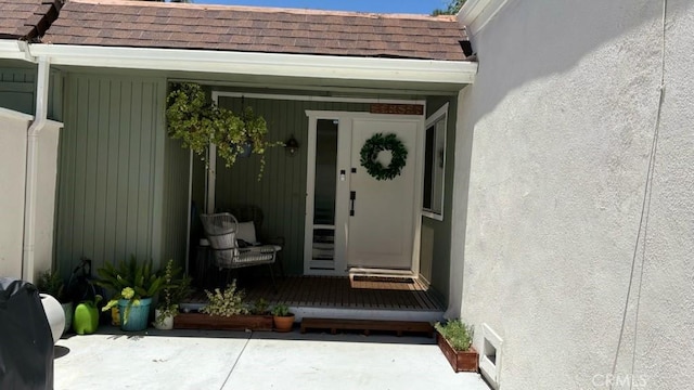 22215 Caminito Vino, Laguna Hills, CA 92653 - property entrance featuring roof with shingles and stucco siding