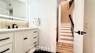 22215 Caminito Vino, Laguna Hills, CA 92653 - bathroom featuring vanity and wood finished floors