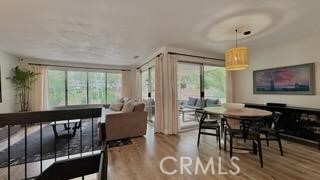 22215 Caminito Vino, Laguna Hills, CA 92653 - dining room featuring wood finished floors and plenty of natural light