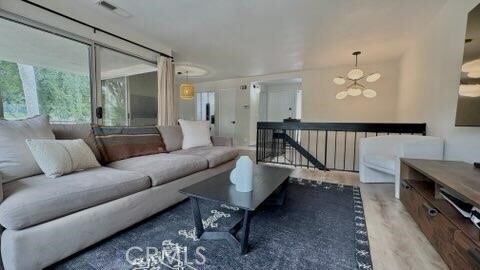 22215 Caminito Vino, Laguna Hills, CA 92653 - living area with a chandelier and wood finished floors