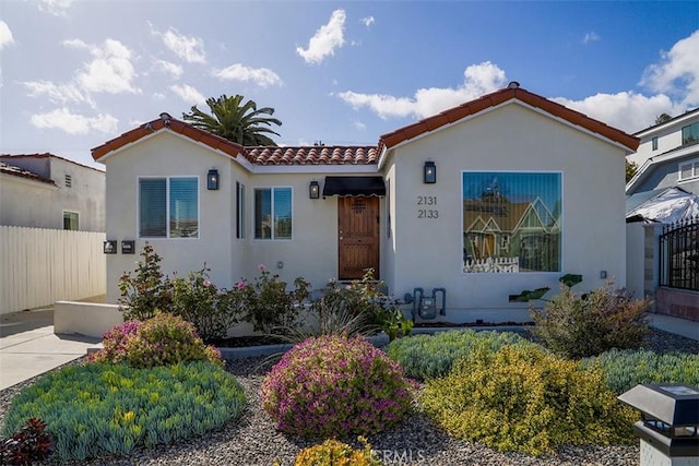 21312133 S Cloverdale Ave, Los Angeles, CA 90016 - mediterranean / spanish house featuring a tile roof and stucco siding