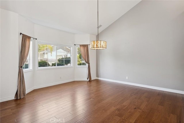 22501 Marilla St, Chatsworth, CA 91311 - spare room featuring a chandelier, lofted ceiling, and dark wood finished floors