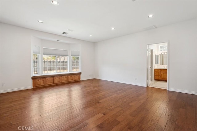 22501 Marilla St, Chatsworth, CA 91311 - empty room with wood finished floors and recessed lighting
