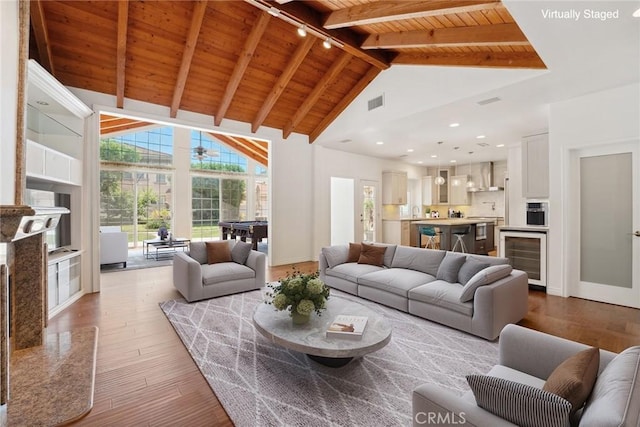 22501 Marilla St, Chatsworth, CA 91311 - living area featuring beverage cooler, a wooden ceiling with exposed beams, hardwood / wood-style floors, track lighting, and high vaulted ceiling
