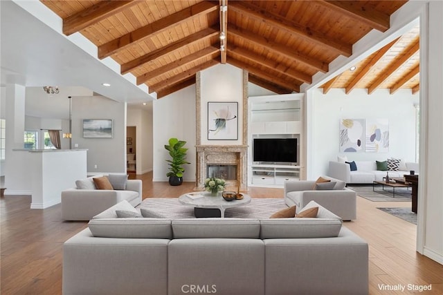 22501 Marilla St, Chatsworth, CA 91311 - living room featuring wooden ceiling, wood finished floors, and a premium fireplace