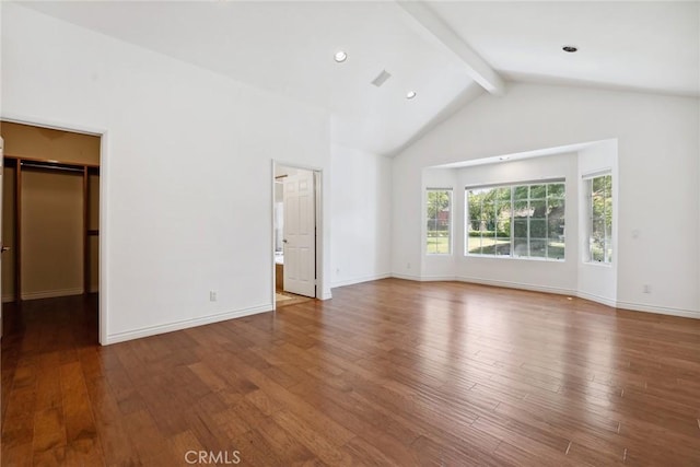 22501 Marilla St, Chatsworth, CA 91311 - unfurnished bedroom featuring beam ceiling, wood finished floors, a walk in closet, and high vaulted ceiling