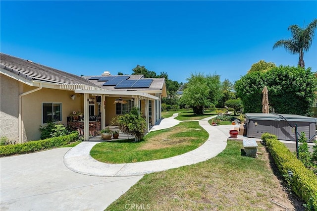 22501 Marilla St, Chatsworth, CA 91311 - view of grassy yard with a hot tub, a patio area, and a ceiling fan