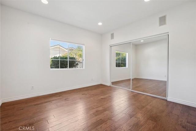 22501 Marilla St, Chatsworth, CA 91311 - unfurnished bedroom with multiple windows, wood finished floors, recessed lighting, and a closet