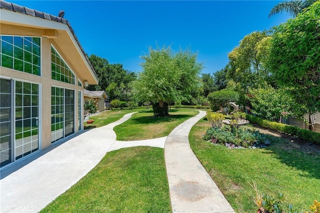 22501 Marilla St, Chatsworth, CA 91311 - view of grassy yard featuring a patio