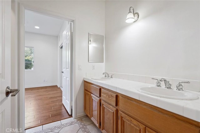 22501 Marilla St, Chatsworth, CA 91311 - full bathroom with double vanity and tile patterned floors