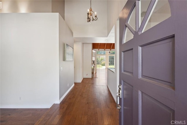 22501 Marilla St, Chatsworth, CA 91311 - foyer with dark wood-type flooring and a chandelier