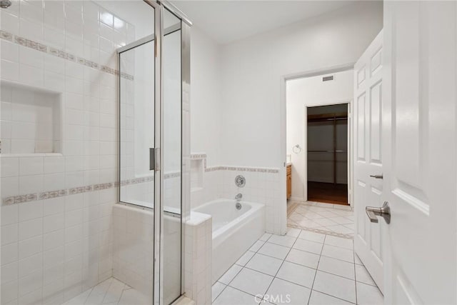 22501 Marilla St, Chatsworth, CA 91311 - bathroom featuring a bath, a shower stall, tile patterned flooring, and tile walls