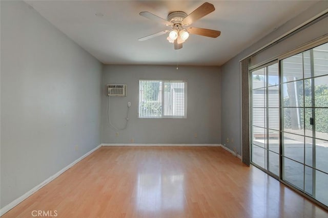 12911 Browning Ave, North Tustin, CA 92705 - spare room with a ceiling fan, wood finished floors, and a wall mounted AC
