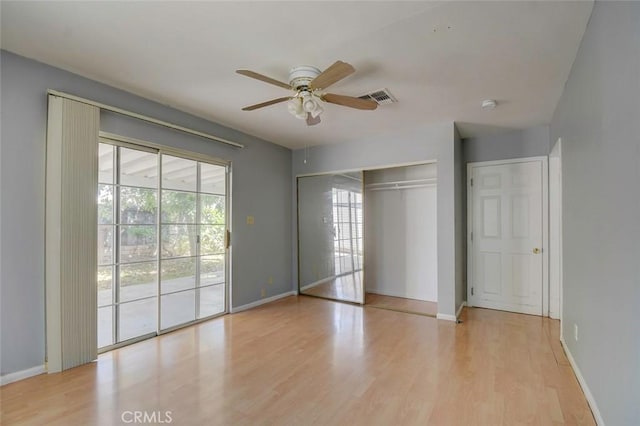 12911 Browning Ave, North Tustin, CA 92705 - unfurnished bedroom featuring access to exterior, wood finished floors, a closet, and a ceiling fan