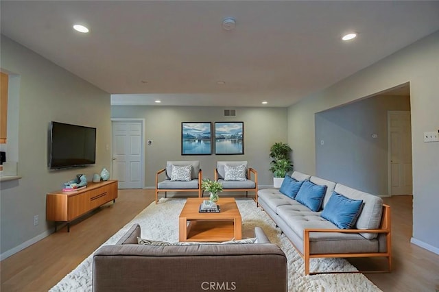 12911 Browning Ave, North Tustin, CA 92705 - living room featuring light wood-type flooring and recessed lighting