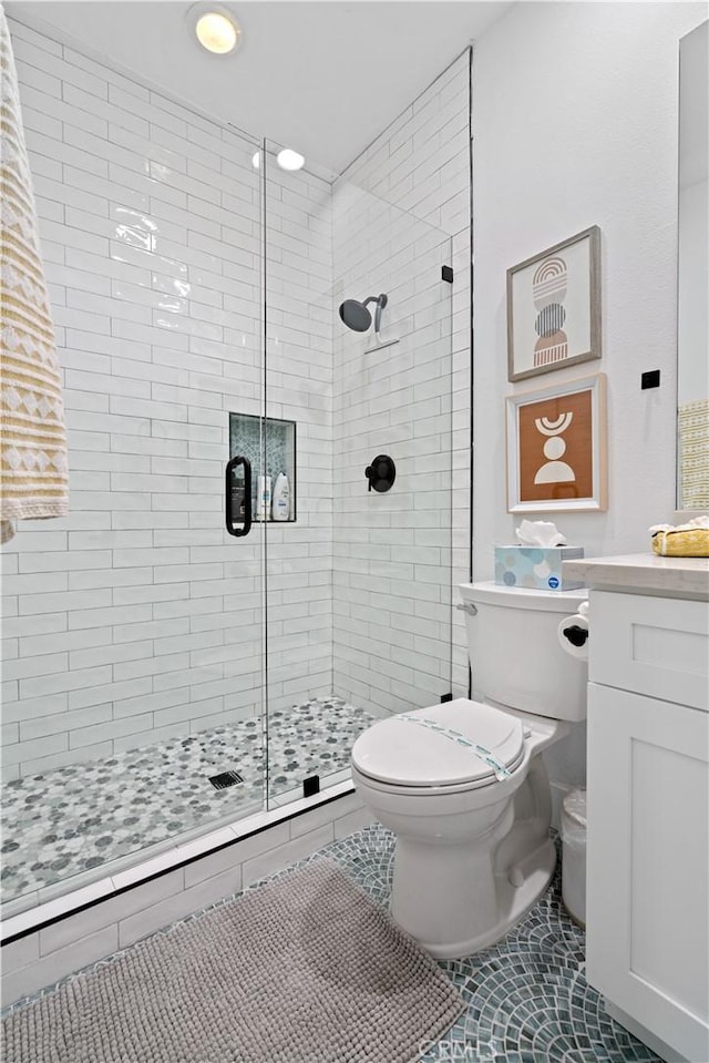56610 Muirfield Ln, Quinta, CA 92253 - full bathroom featuring a stall shower, vanity, and tile patterned floors