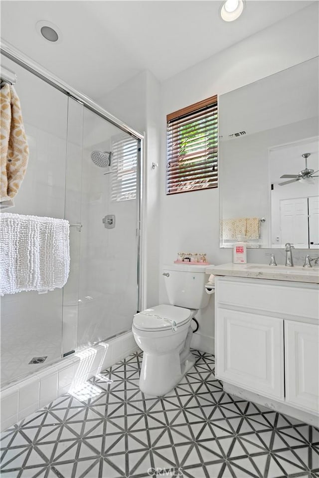 56610 Muirfield Ln, Quinta, CA 92253 - full bath featuring vanity, a shower stall, a ceiling fan, and tile patterned floors