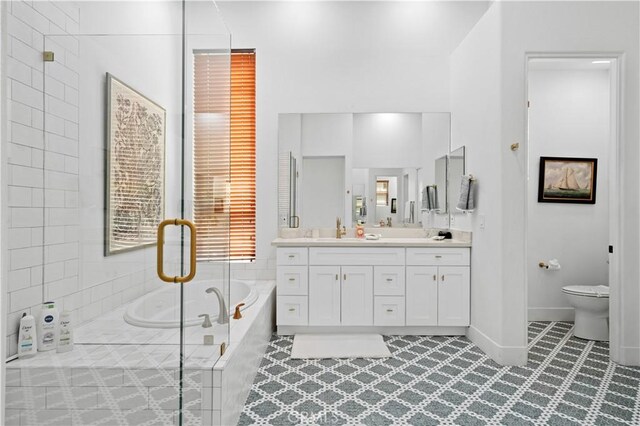 56610 Muirfield Ln, Quinta, CA 92253 - bathroom featuring vanity, a garden tub, an enclosed shower, and tile patterned flooring