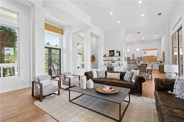56610 Muirfield Ln, Quinta, CA 92253 - living area with beverage cooler, light wood-type flooring, and recessed lighting