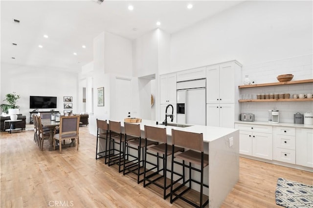 56610 Muirfield Ln, Quinta, CA 92253 - kitchen featuring paneled built in refrigerator, a high ceiling, decorative backsplash, light countertops, and recessed lighting