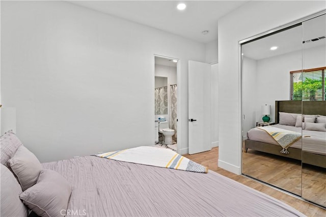 56610 Muirfield Ln, Quinta, CA 92253 - bedroom with a closet, light wood-style floors, recessed lighting, and ensuite bath