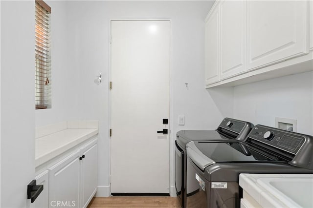56610 Muirfield Ln, Quinta, CA 92253 - laundry room featuring cabinet space, washer and dryer, and light wood-style flooring