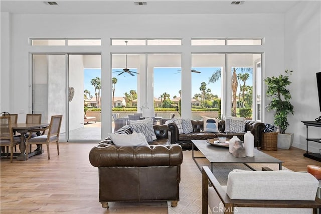 56610 Muirfield Ln, Quinta, CA 92253 - living area with ceiling fan, light wood-style floors, and healthy amount of natural light