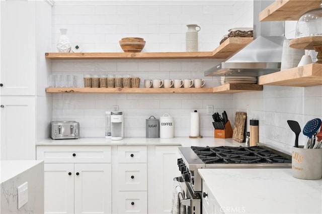 56610 Muirfield Ln, Quinta, CA 92253 - kitchen featuring open shelves, high end stainless steel range, wall chimney exhaust hood, and tasteful backsplash