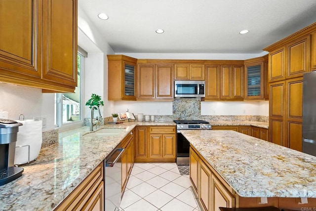 18103 Smokesignal Dr, San Diego, CA 92127 - kitchen with appliances with stainless steel finishes, brown cabinets, light stone counters, light tile patterned floors, and recessed lighting