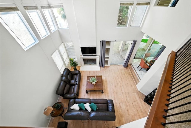 18103 Smokesignal Dr, San Diego, CA 92127 - living room featuring a high ceiling, a skylight, wood finished floors, and stairway