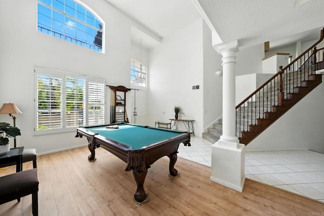 18103 Smokesignal Dr, San Diego, CA 92127 - game room with a towering ceiling, wood finished floors, billiards table, and ornate columns