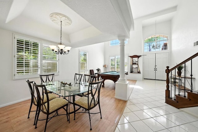 18103 Smokesignal Dr, San Diego, CA 92127 - dining area featuring a chandelier, decorative columns, billiards, a tray ceiling, and stairs