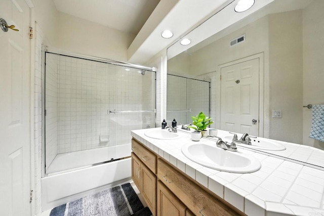 18103 Smokesignal Dr, San Diego, CA 92127 - full bathroom featuring double vanity, shower / bath combination with glass door, and recessed lighting