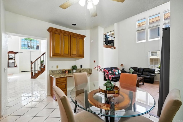 18103 Smokesignal Dr, San Diego, CA 92127 - dining area featuring a ceiling fan, light tile patterned floors, and stairway