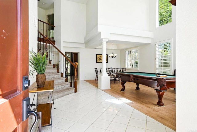 18103 Smokesignal Dr, San Diego, CA 92127 - playroom with a high ceiling, billiards, light tile patterned flooring, and a chandelier