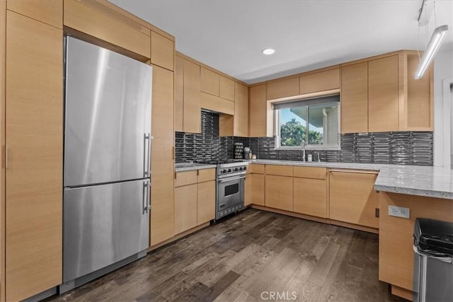 1411 N Hayworth Ave Unit 15, West Hollywood, CA 90046 - kitchen featuring stainless steel appliances, light brown cabinetry, dark wood-style floors, decorative backsplash, and recessed lighting