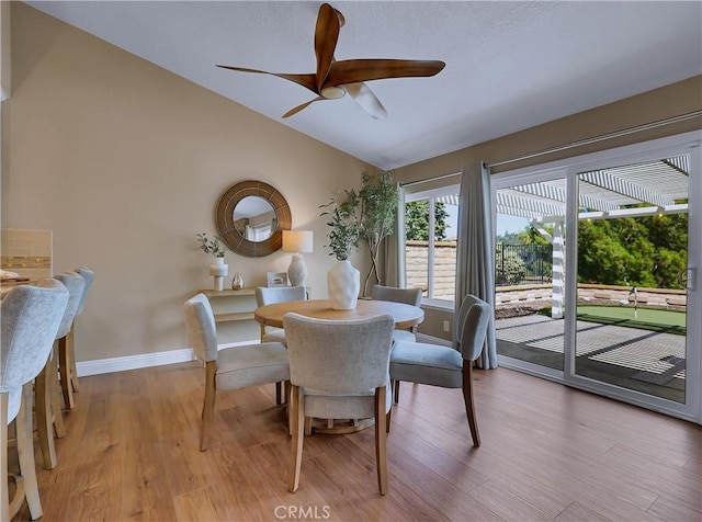 22182 Platino, Mission Viejo, CA 92691 - dining room featuring vaulted ceiling, ceiling fan, and light wood-style floors