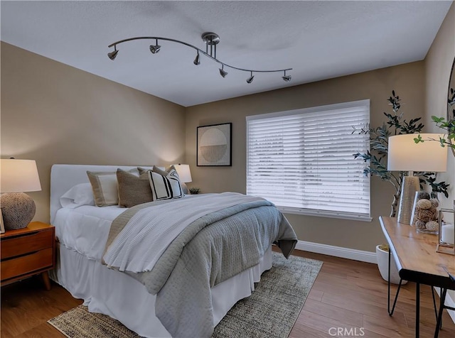 22182 Platino, Mission Viejo, CA 92691 - bedroom with wood finished floors and track lighting