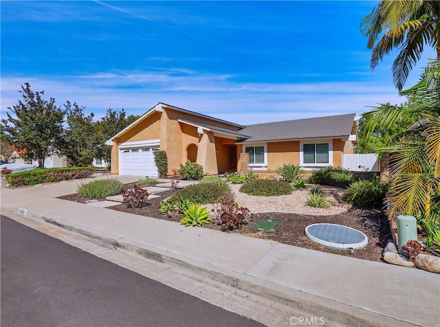 22182 Platino, Mission Viejo, CA 92691 - view of front of property featuring stucco siding, an attached garage, and driveway