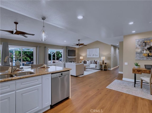 22182 Platino, Mission Viejo, CA 92691 - kitchen featuring a ceiling fan, stainless steel dishwasher, white cabinets, light wood finished floors, and light stone countertops