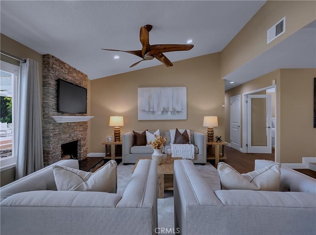22182 Platino, Mission Viejo, CA 92691 - living area with ceiling fan, vaulted ceiling, a fireplace, and wood finished floors