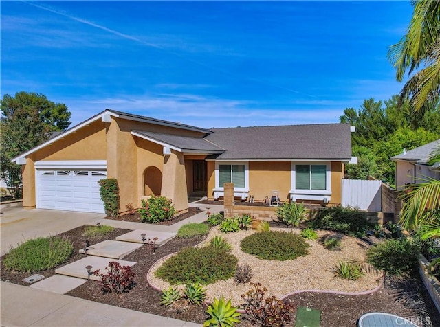 22182 Platino, Mission Viejo, CA 92691 - view of front of house featuring stucco siding, concrete driveway, and a garage