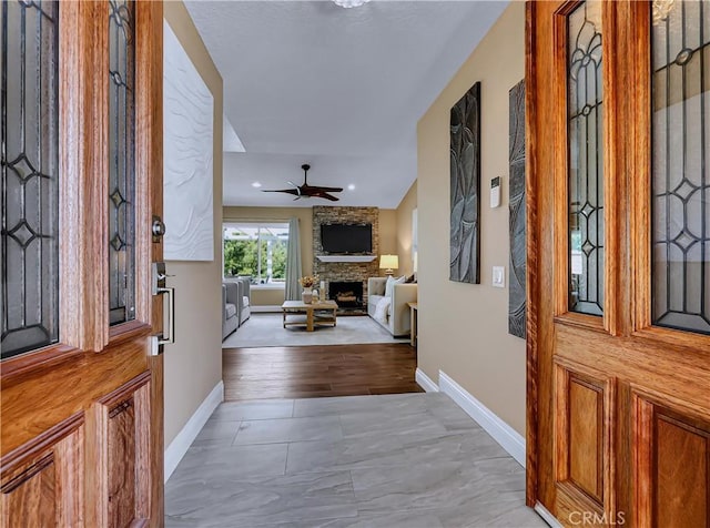 22182 Platino, Mission Viejo, CA 92691 - entryway featuring a stone fireplace, a ceiling fan, and recessed lighting